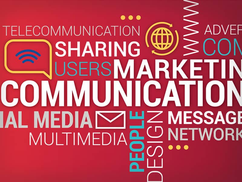 Colorful word cloud with terms like communication, marketing, social media, sharing, and network on a red background